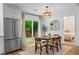 Dining area with backyard views through sliding doors, adjacent to the kitchen at 2565 Bates Se St, Smyrna, GA 30080