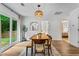 Bright dining room boasts a modern light fixture and outdoor views through sliding glass doors at 2565 Bates Se St, Smyrna, GA 30080