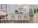 Modern eat-in kitchen featuring a large island with stone countertops and counter seating at 2565 Bates Se St, Smyrna, GA 30080