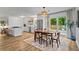 An open concept kitchen and dining area with stainless appliances and view of the backyard at 2565 Bates Se St, Smyrna, GA 30080