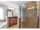 Beautiful bathroom featuring granite countertops, soaking tub and glass enclosed shower with neutral color palette at 2690 Derby Ne Walk # 53, Atlanta, GA 30319