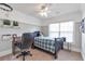 Bedroom features plush carpet, ceiling fan, window, half painted walls, desk and bed at 2690 Derby Ne Walk # 53, Atlanta, GA 30319