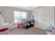 Bedroom features plush carpet, bunk beds, white walls and a window providing natural light at 2690 Derby Ne Walk # 53, Atlanta, GA 30319