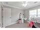 Bedroom features plush carpet, bunk beds, white walls, window and a desk at 2690 Derby Ne Walk # 53, Atlanta, GA 30319