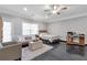 Bedroom features hard flooring, ceiling fan, window, neutral walls, bed and furniture at 2690 Derby Ne Walk # 53, Atlanta, GA 30319