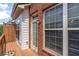 Charming deck featuring a wooden railing, brick exterior, and door with glass window at 2690 Derby Ne Walk # 53, Atlanta, GA 30319