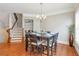 Cozy dining room with hardwood floors, stairs, and a coffee bar nook at 2690 Derby Ne Walk # 53, Atlanta, GA 30319