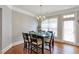 Bright dining room features hardwood floors, a large window, and access to outdoor space at 2690 Derby Ne Walk # 53, Atlanta, GA 30319