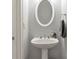 Cozy half bathroom with gray walls, white accents, pedestal sink, and stylish fixtures at 2690 Derby Ne Walk # 53, Atlanta, GA 30319