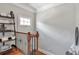 Upstairs landing with hardwood floors and decorative shelving at 2690 Derby Ne Walk # 53, Atlanta, GA 30319