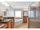 Bright main bathroom showcases double vanities, soaking tub, and separate shower at 2690 Derby Ne Walk # 53, Atlanta, GA 30319