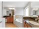 Luxurious main bathroom with double vanities, a soaking tub, and separate shower at 2690 Derby Ne Walk # 53, Atlanta, GA 30319