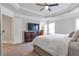 Large main bedroom featuring plush carpet, tray ceiling, and ample natural light at 2690 Derby Ne Walk # 53, Atlanta, GA 30319