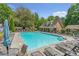 Enjoy the community pool and lounge area surrounded by lush greenery and a pool house at 2690 Derby Ne Walk # 53, Atlanta, GA 30319