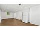 Unfinished basement with painted walls, tile ceiling, and a doorway to an adjacent room at 2746 Sanibel Se Ln, Smyrna, GA 30082