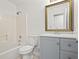 Clean bathroom with a shower-tub combo, new vanity, and modern gold-toned hardware at 2746 Sanibel Se Ln, Smyrna, GA 30082