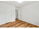 Bedroom featuring laminate wood flooring and white doors at 2746 Sanibel Se Ln, Smyrna, GA 30082
