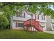 Two-story home with white siding, red shutters, and a wooden deck at 2746 Sanibel Se Ln, Smyrna, GA 30082