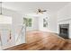 Bright and airy living room with a fireplace, and hardwood floors at 2746 Sanibel Se Ln, Smyrna, GA 30082