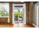 An open balcony with exposed brickwork offering a serene view of lush greenery at 3235 Roswell Ne Rd # 521, Atlanta, GA 30305