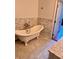 Bathroom with a clawfoot bathtub and marble floors and walls at 3235 Roswell Ne Rd # 521, Atlanta, GA 30305
