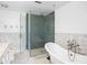 Bright bathroom with a soaking tub and stand up glass shower with chrome fixtures at 3235 Roswell Ne Rd # 521, Atlanta, GA 30305