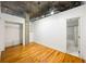 Spacious bedroom with wood floors, closet, and bathroom access at 3235 Roswell Ne Rd # 521, Atlanta, GA 30305