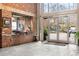 Brick building entrance with floor to ceiling windows and glass doors at 3235 Roswell Ne Rd # 521, Atlanta, GA 30305