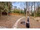Community dog park featuring waste disposal, mulch ground cover, and stone pathway at 3235 Roswell Ne Rd # 521, Atlanta, GA 30305