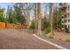 Community dog park featuring a fence and a stone path among the trees at 3235 Roswell Ne Rd # 521, Atlanta, GA 30305