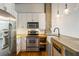 Modern kitchen with stainless appliances, farm sink, and concrete countertop on wood island at 3235 Roswell Ne Rd # 521, Atlanta, GA 30305