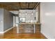 Kitchen island with concrete countertop and wood trim complements stainless steel appliances at 3235 Roswell Ne Rd # 521, Atlanta, GA 30305