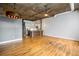 Open floorplan featuring hardwood floors, exposed ceilings, and a stylishly appointed kitchen at 3235 Roswell Ne Rd # 521, Atlanta, GA 30305
