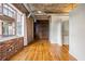 Open living space with exposed brick, hardwood floors, and large windows providing plenty of natural light at 3235 Roswell Ne Rd # 521, Atlanta, GA 30305
