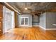 Bright and airy living room with exposed ceilings, hardwood floors, and modern accents at 3235 Roswell Ne Rd # 521, Atlanta, GA 30305