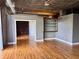 Bright living room with hardwood floors leading to another room with wood paneling at 3235 Roswell Ne Rd # 521, Atlanta, GA 30305