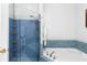 Bathroom with tiled shower, bathtub, and modern fixtures at 375 Highland Ne Ave # 913, Atlanta, GA 30312