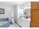 Bathroom with white vanity, marble countertop, cabinet, and a separate shower and tub with blue tile at 375 Highland Ne Ave # 913, Atlanta, GA 30312