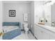 Bright bathroom featuring white marble vanity and tub with unique blue tiling at 375 Highland Ne Ave # 913, Atlanta, GA 30312