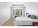 Bedroom with neutral walls, bay window with tree view, and trey ceiling at 375 Highland Ne Ave # 913, Atlanta, GA 30312