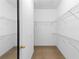 Bright walk-in closet featuring wire shelving, carpeting and natural light at 375 Highland Ne Ave # 913, Atlanta, GA 30312