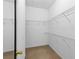 Spacious walk-in closet featuring wire shelving and carpeting at 375 Highland Ne Ave # 913, Atlanta, GA 30312