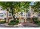 Inviting townhome exterior with attached garages and well-maintained landscaping offering curb appeal at 375 Highland Ne Ave # 913, Atlanta, GA 30312