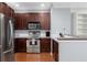 Well-equipped kitchen featuring stainless steel appliances, stylish wood cabinetry, and ample counter space at 375 Highland Ne Ave # 913, Atlanta, GA 30312