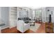 Comfortable living room featuring built-in shelving, hardwood floors, and bright natural light at 375 Highland Ne Ave # 913, Atlanta, GA 30312