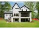 Back exterior view of modern home with deck and outdoor living space at 4091 Oak Forest Ne Dr, Brookhaven, GA 30319