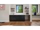 Home wet bar with black cabinetry, light countertop and floating shelves above at 4091 Oak Forest Ne Dr, Brookhaven, GA 30319