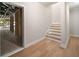 Basement entrance leads to unfinished space with stairs and wood floors at 4091 Oak Forest Ne Dr, Brookhaven, GA 30319
