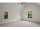 Bedroom featuring vaulted ceiling, fan and black-framed windows at 4091 Oak Forest Ne Dr, Brookhaven, GA 30319