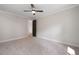 Spacious bedroom featuring plush carpeting and a modern ceiling fan at 4091 Oak Forest Ne Dr, Brookhaven, GA 30319